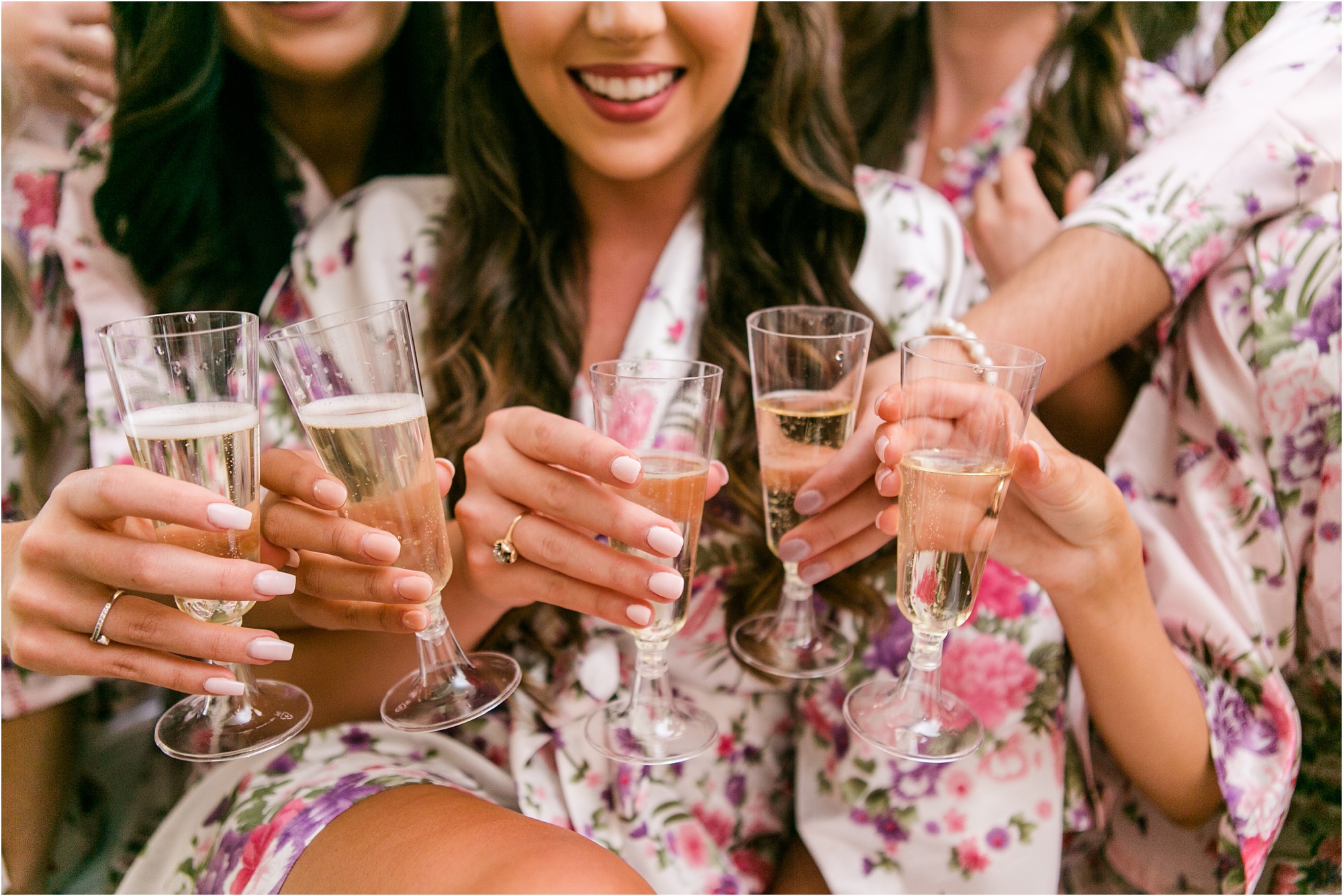macon wedding bridal party drinks champagne on bed