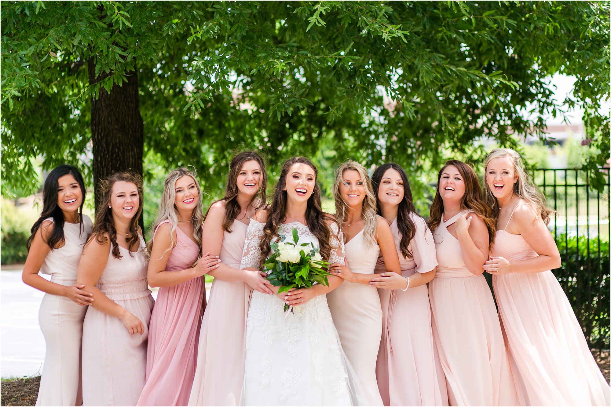 pink and blush bridesmaids laughing dresses and lace bridal gown macon wedding
