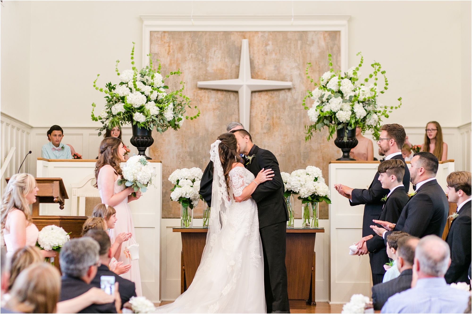 first kiss as husband and wife white and wood church macon georgia wedding