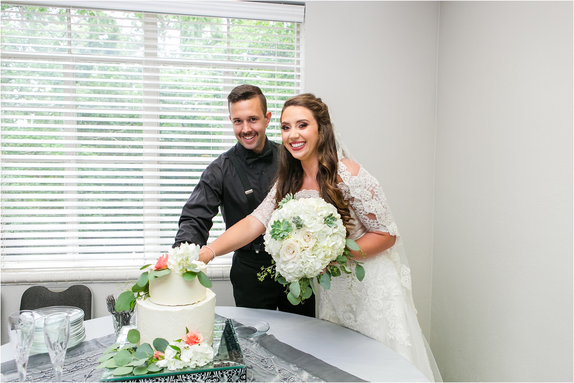 bride and groom macon georgia summer wedding cutting cake